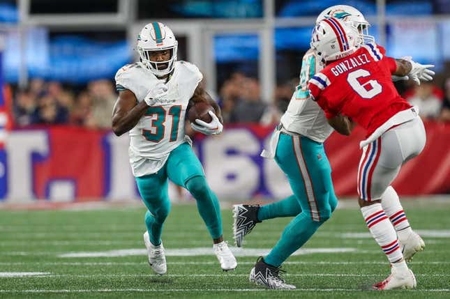 Sep 17, 2023; Foxborough, Massachusetts, USA; Miami Dolphins running back Raheem Mostert (31) runs the ball during the first half against the New England Patriots at Gillette Stadium.