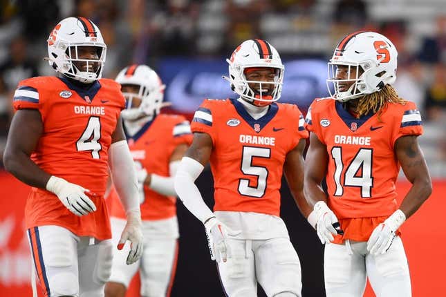 Sep 9, 2023; Syracuse, New York, USA; Syracuse Orange defensive lineman Caleb Okechukwu (4) and defensive back Alijah Clark (5) and defensive back Jason Simmons Jr. (14) reacts to a play against the Western Michigan Broncos during the second half at the JMA Wireless Dome.