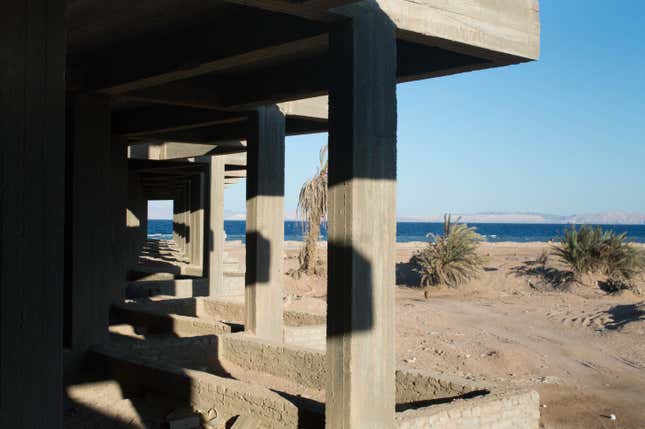 Columns extend toward the sea at an abandoned complex in Dahab.