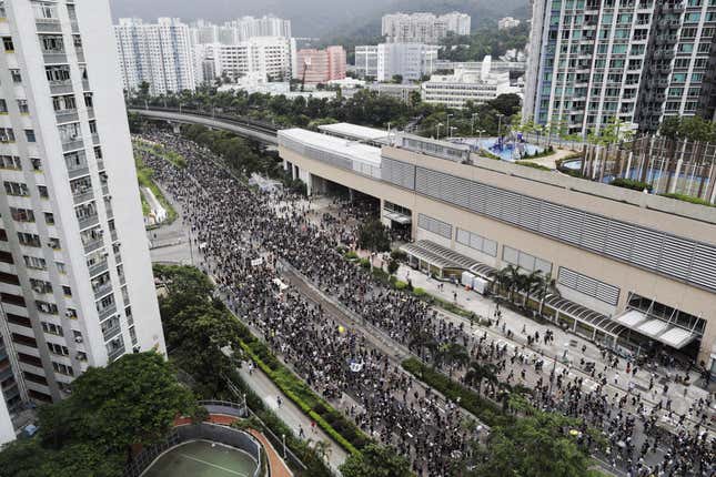 Protesters march through the Sha Tin District in Hong Kong, July 14, 2019.