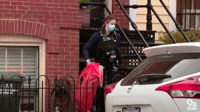 Washington, DC, Medical Examiner removes red biohazard bag containing five fetuses from the home of anti-abortion activist Lauren Handy on March 30, 2022.