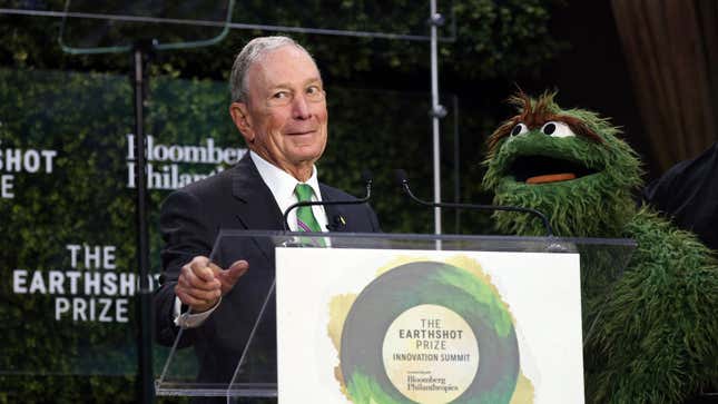 Bloomberg poses with Oscar the Grouch during a summit in New York City on Wednesday.