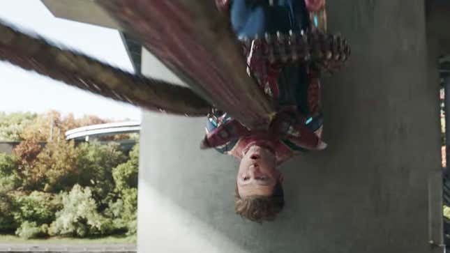 Doctor Octopus's robotic tentacle pins the unmasked Spider-Man's body to a concrete pillar.