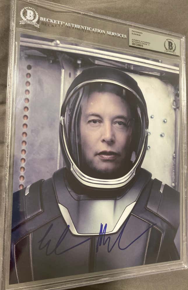 A signed 8x10 Photo of Elon Musk wearing a spacesuit that I found on eBay.
