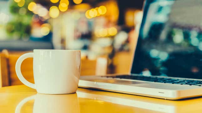 mug on desk, next to laptop 