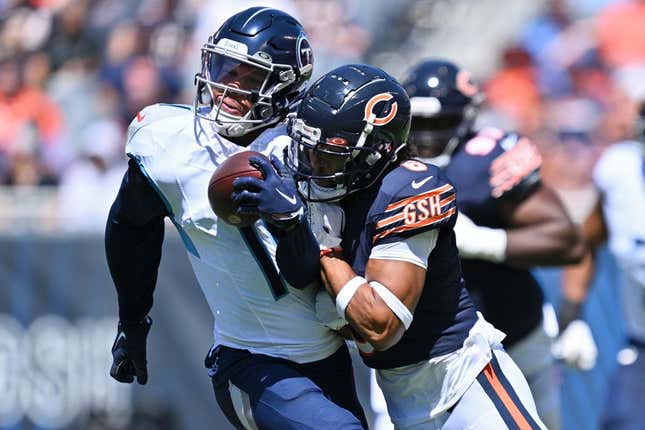 Aug 12, 2023; Chicago, Illinois, USA; Chicago Bears defensive back Kyler Gordon (6) tackles Tennessee Titans wide receiver Chris Moore (11) in the first quarter at Soldier Field.
