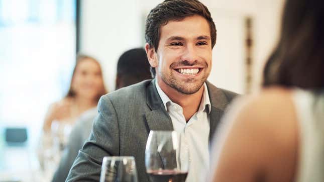 Man grinning at female date