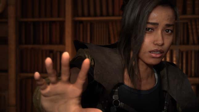 Frey, the femal protagonist of Forspoken, holds her hand up to the camera.