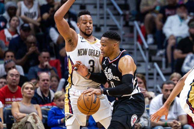 Apr 1, 2023; New Orleans, Louisiana, USA;  LA Clippers guard Russell Westbrook (0) dribbles against New Orleans Pelicans guard CJ McCollum (3) during the first half at Smoothie King Center.