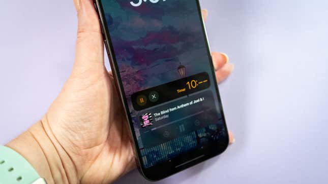 A photo of a person holding the iPhone 14 Pro Max