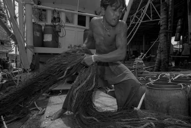 A migrant worker on a boat from Thailand’s Ranong province.