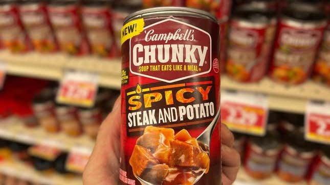 Campbell's Chunky Spicy steak and potato soup can in grocery store