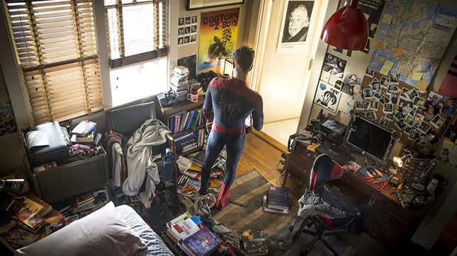 Andrew Garfield standing in Peter parker's room as spider-man.