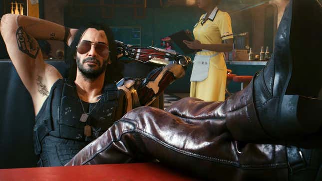 Cyberpunk 2077's Johnny Silverhand sits in a diner, his legs kicked up on the table, chillin.