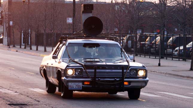 The Bluesmobile car from The Blues Brothers with a megaphone on the roof. 
