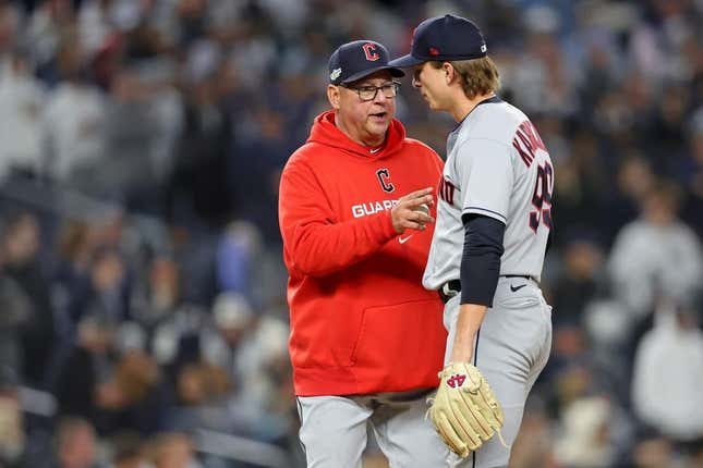 Oct 18, 2022; Bronx, New York, USA; Cleveland Guardians manager Terry Francona (77) takes relief pitcher James Karinchak (99) out of the game against the New York Yankees during the seventh inning in game five of the ALDS for the 2022 MLB Playoffs at Yankee Stadium.