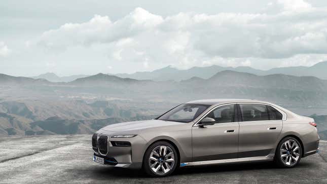 A render of the new BMW i7 all-electric sedan parked on a mountain top. 