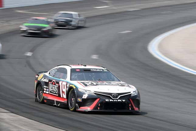 Jul 17, 2023; Loudon, New Hampshire, USA; NASCAR Cup Series driver Martin Truex Jr. (19) races into turn two during the Crayon 301 at New Hampshire Motor Speedway.