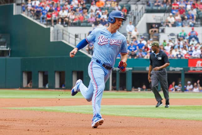 May 21, 2023; Arlington, TX, USA; Texas Rangers third baseman Josh Jung (6) hits a ben in the second inning against the Colorado Rockies at Globe Life Field base hit.