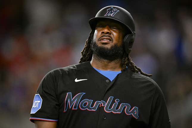 Aug 4, 2023; Arlington, Texas, USA; Miami Marlins designated hitter Josh Bell (9) reacts to striking out against the Texas Rangers during the sixth inning at Globe Life Field.