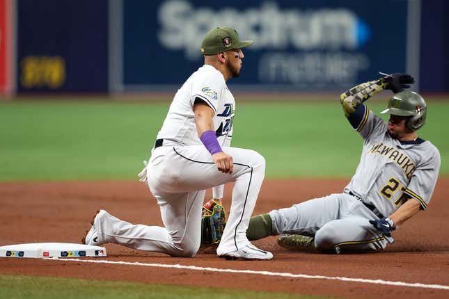 May 19, 2023;  St. Petersburg, Florida, USA;  Milwaukee Brewers shortstop Willie Adams (27) is tagged out at third base by Tampa Bay Rays third baseman Isaac Paredes (17) in the second inning at Tropicana Field.