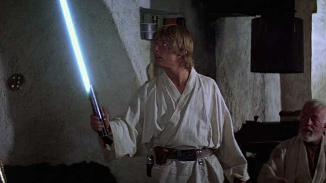 A screenshot shows Luke holding a lightsaber in Star Wars. 