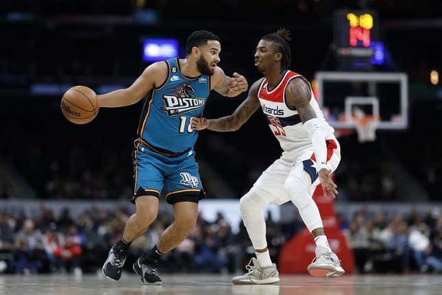 Mar 14, 2023; Washington, District of Columbia, USA; Detroit Pistons guard Cory Joseph (18) dribbles the ball as Washington Wizards guard Delon Wright (55) defends in the second quarter at Capital One Arena.