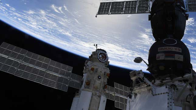 The Nauka module next to a Soyuz spacecraft. 
