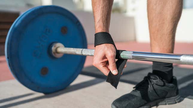 wrapping a strap around a deadlift bar