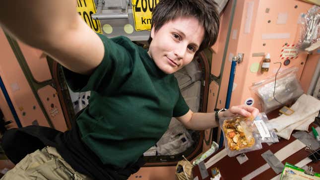 European Space Agency astronaut Samantha Cristoforetti preparing a meal aboard the ISS on December 8, 2014.