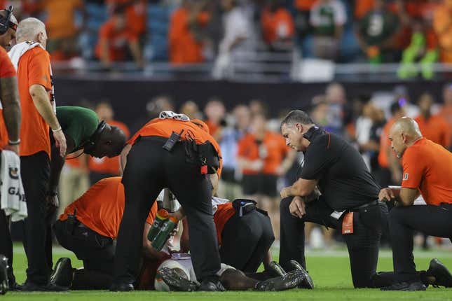 Sep 9, 2023; Miami Gardens, Florida, USA; Miami Hurricanes head coach Mario Cristobal looks on as trainers check on Miami Hurricanes safety Kamren Kinchens (5) after an injury against the Texas A&amp;amp;M Aggies during the fourth quarter at Hard Rock Stadium.