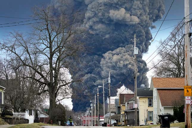 A black plume rises over East Palestine, Ohio, as a result of the controlled detonation of a portion of the derailed Norfolk Southern trains Monday, Feb. 6, 2023.