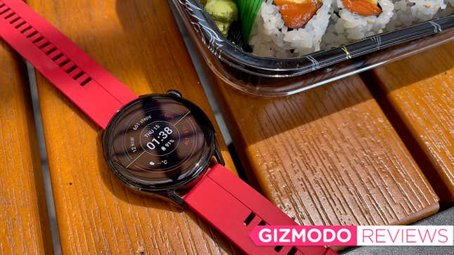 The Huawei Watch 3 on a wooden table near sushi