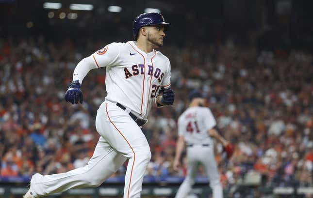 Aug 23, 2023; Houston, Texas, USA; Boston Red Sox starting pitcher Chris Sale (41) reacts and Houston Astros designated hitter Yainer Diaz (21) runs to first base after hitting a single during the third inning at Minute Maid Park.