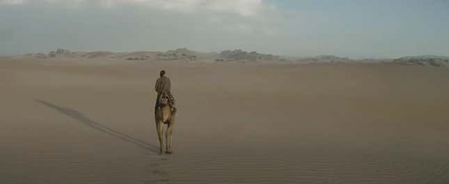 Obi-Wan rides his Eopie across the Tatooine desert.