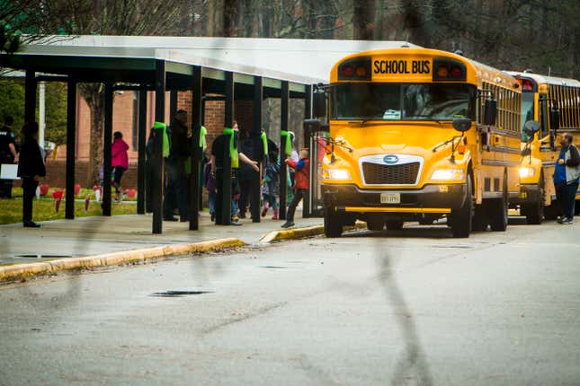 Students exit a school bus during the first day back to Richneck Elementary School on Monday Jan. 30, 2023 in Newport News, Va. The Virginia elementary school where a 6-year-old boy shot his teacher has reopened with stepped-up security and a new administrator.

