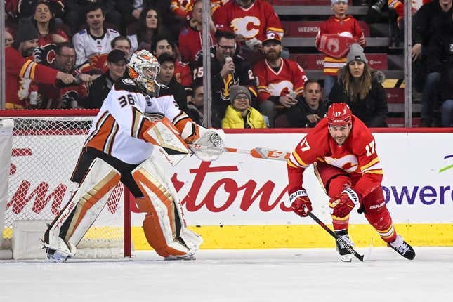 Mar 10, 2023; Calgary, Alberta, CAN; Anaheim Ducks goaltender John Gibson (36) gives Calgary Flames left wing Milan Lucic (17) a push as he struggles to get up during the second period at Scotiabank Saddledome.