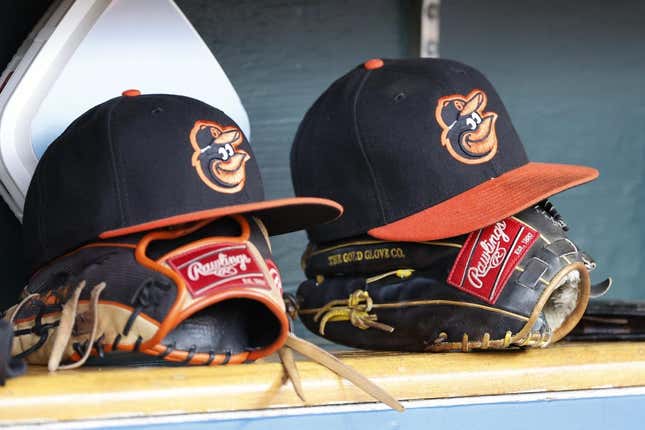 Apr 27, 2023; Detroit, Michigan, USA;  Baltimore Orioles hats and glove sits in dugout in the second inning against the Detroit Tigers at Comerica Park.