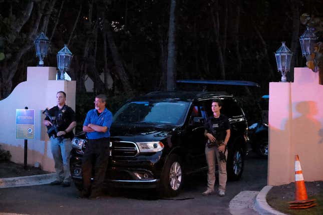 Armed Secret Service agents stand outside an entrance to former President Donald Trump’s Mar-a-Lago estate, late Monday, Aug. 8, 2022, in Palm Beach, Fla. Trump said in a lengthy statement that the FBI was conducting a search of his Mar-a-Lago estate and asserted that agents had broken open a safe.