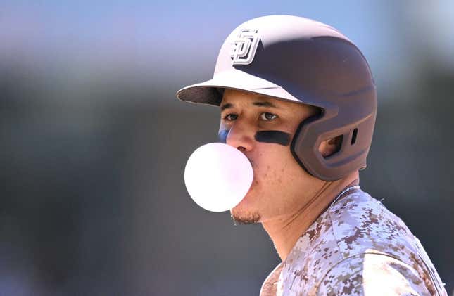 Jun 25, 2023; San Diego, California, USA; San Diego Padres third baseman Manny Machado (13) blows a bubble-gum bubble during the sixth inning against the Washington Nationals at Petco Park.