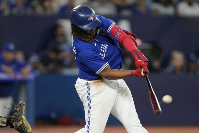 Jun 24, 2023; Toronto, Ontario, CAN; Toronto Blue Jays first baseman Vladimir Guerrero Jr. (27) hits a two run home run against the Oakland Athletics during the sixth inning at Rogers Centre.