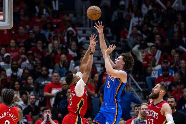 Apr 12, 2023; New Orleans, Louisiana, USA; Oklahoma City Thunder guard Josh Giddey (3) shoots a jump shot over New Orleans Pelicans guard CJ McCollum (3) during the second half at Smoothie King Center.