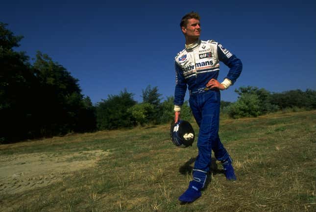 Williams Renault driver David Coulthard of Great Britain walks back to the pits after spinning off the track during the 1994 Hungarian Grand Prix.