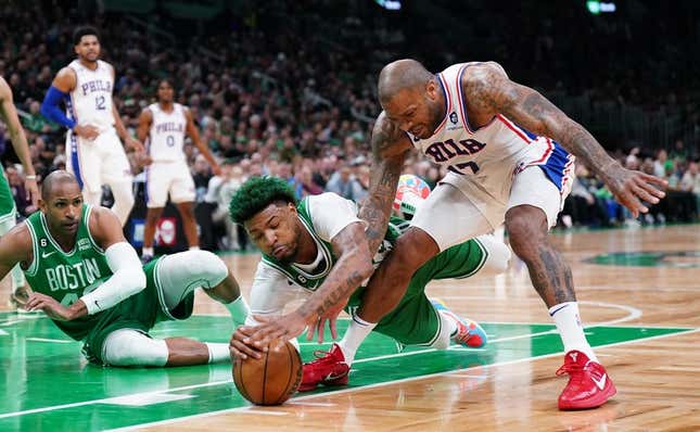 May 3, 2023; Boston, Massachusetts, USA; Boston Celtics guard Marcus Smart (36) works for the ball against Philadelphia 76ers forward P.J. Tucker (17) in the first quarter during game two of the 2023 NBA playoffs at TD Garden.