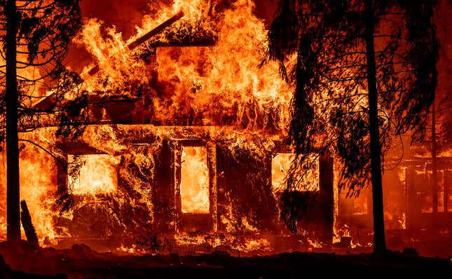 A home burns as flames from the Dixie fire tear through the Indian Falls neighborhood of unincorporated Plumas County, California on July 24, 2021. - The Dixie fire, which started only a few miles from the origin of the deadly Camp fire, has churned through more than 185,000 acres and continues to burn towards rural communities.