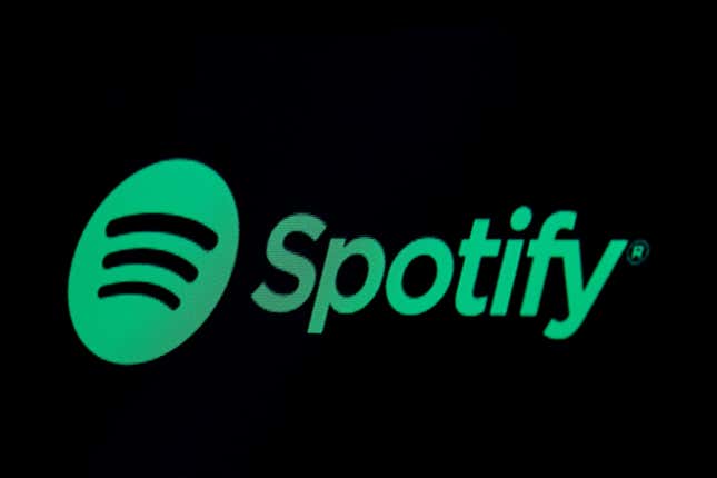 An image of the Spotify logo in green set against a black background.