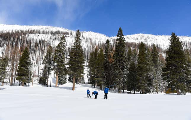 Water resource officials near the Phillips Station in the Sierra Nevada Mountains.