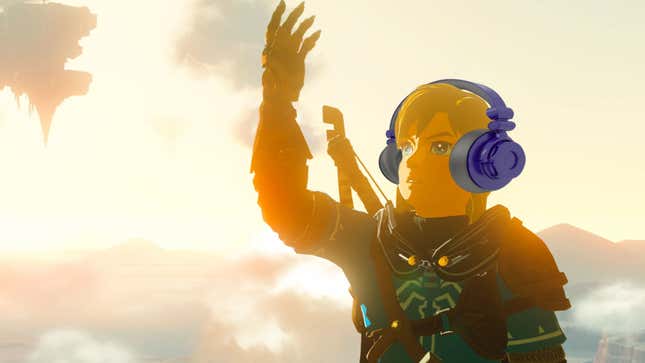 Link in Tears of the Kingdom is holding his open hand into the sky, looking at something off-screen with a pair of headphones on.