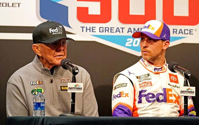 Feb 17, 2020; Daytona Beach, Florida, USA; NASCAR Cup Series driver Denny Hamlin (11) speaks to media with team owner Joe Gibbs (left) after the Daytona 500 at Daytona International Speedway.