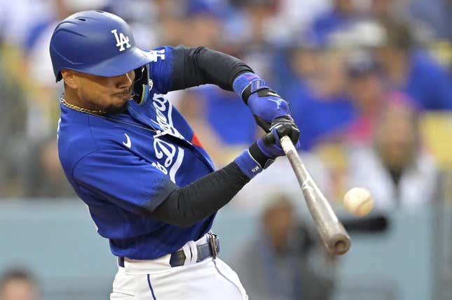 Aug 19, 2023; Los Angeles, California, USA;  Los Angeles Dodgers right fielder Mookie Betts (50) hits a solo home run in the third inning against the Miami Marlins at Dodger Stadium.